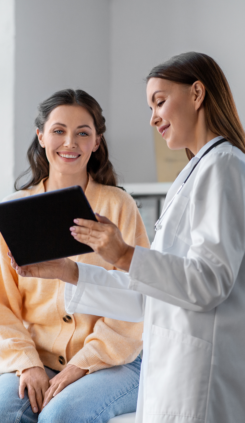 The image shows a modern dental or medical office interior with a dental chair, equipment, and a clean, professional environment.